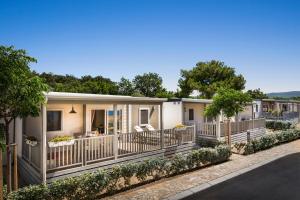 a row of mobile homes on the side of a road at Valamar Camping Krk in Krk