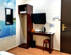 TV a/nebo společenská místnost v ubytování Comfort Hotel