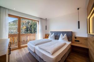 Säng eller sängar i ett rum på Oberegghof Ferienwohnung Ifinger