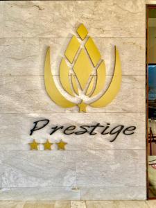 a sign for a restaurant on a wall at Prestige Hotel & Spa in Tétouan