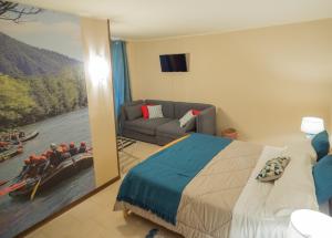 Postel nebo postele na pokoji v ubytování Rafting Hotel Ai Cavallini