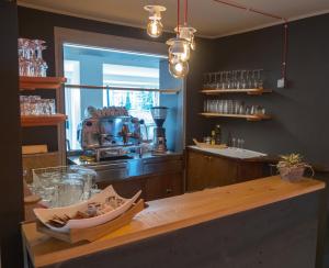 a kitchen with a wooden counter with a counter top at Rafting Hotel Ai Cavallini in Solagna
