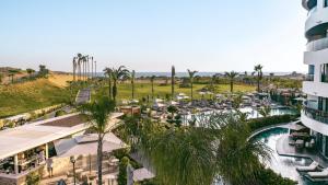 an aerial view of a resort with a pool and palm trees at Liu Resorts in Side