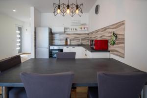 Kuchyň nebo kuchyňský kout v ubytování Apartman Antea 1