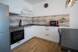 Kuchyň nebo kuchyňský kout v ubytování Apartman Antea 1