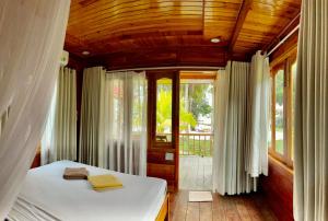 Postel nebo postele na pokoji v ubytování Cay Sao Resort + 37 fotografií