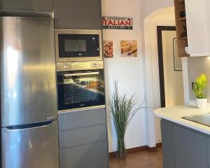 A kitchen or kitchenette at TUSCANY LOFT IN THE CITY