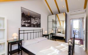 a bedroom with a bed and a large window at Holiday Home Avantgarde in Dubrovnik