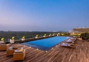 a large swimming pool on top of a building at Vivanta Bhubaneswar DN Square in Bhubaneshwar