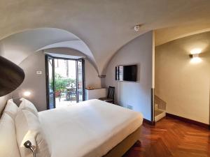 Ein Bett oder Betten in einem Zimmer der Unterkunft Hotel Garibaldi Blu - WTB Hotels
