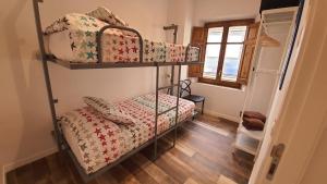 A bed or beds in a room at Ca La Fustereta