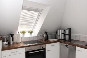 Kuchyň nebo kuchyňský kout v ubytování Ferienwohnung Seeloft mit Balkon und Seeblick