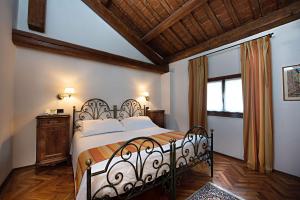 Tempat tidur dalam kamar di Best Western Plus Hotel Villa Tacchi