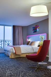 A bed or beds in a room at Park Inn by Radisson Dammam