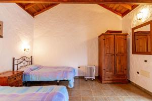 Postelja oz. postelje v sobi nastanitve Casa Rural Los Escobones