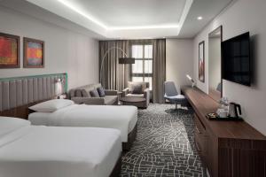 Park Inn by Radisson Makkah Aziziyah客房内的一张或多张床位