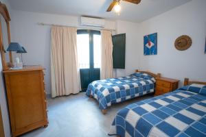 Ένα ή περισσότερα κρεβάτια σε δωμάτιο στο Apartamento BALCON DE EUROPA 4 MENYBER