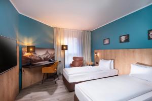 Postel nebo postele na pokoji v ubytování Mercure Hotel München Neuperlach Süd