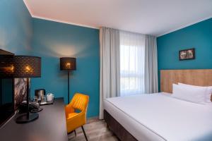 Postel nebo postele na pokoji v ubytování Mercure Hotel München Neuperlach Süd