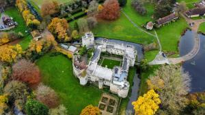 an aerial view of an old castle in a park at Lady Florence, Maidstone a Unique River Boat with Castle Views in Kent