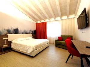 Posteľ alebo postele v izbe v ubytovaní Hotel Luna