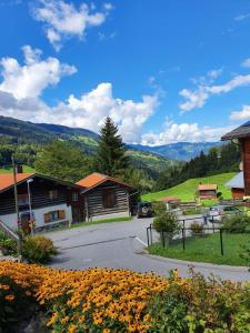 a view of a village with mountains in the background at Chalet Pagrüeg in Klosters Serneus