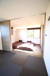 A bed or beds in a room at オザッキー大室高原4丁目