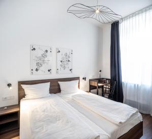 Postel nebo postele na pokoji v ubytování acor Boutique Hotel