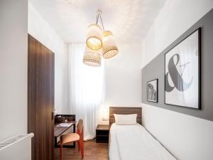 Postel nebo postele na pokoji v ubytování acor Boutique Hotel