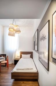 Postel nebo postele na pokoji v ubytování acor Boutique Hotel