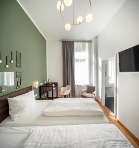 Postel nebo postele na pokoji v ubytování acor Boutique Hotel
