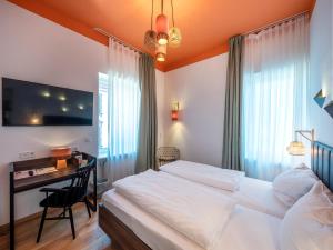 Postel nebo postele na pokoji v ubytování acor Boutique Hotel