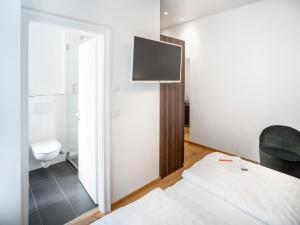 TV a/nebo společenská místnost v ubytování acor Boutique Hotel