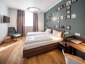 Postel nebo postele na pokoji v ubytování acor Boutique Hotel