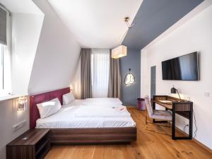 Postel nebo postele na pokoji v ubytování acor Boutique Hotel