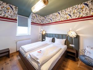 Postel nebo postele na pokoji v ubytování acor Boutique Hotel