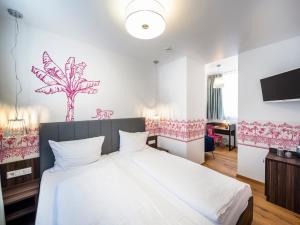 Postel nebo postele na pokoji v ubytování acor Boutique Hotel