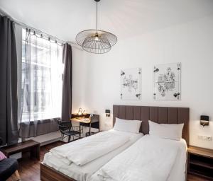 Postel nebo postele na pokoji v ubytování acor Boutique Hotel