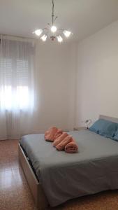 Postel nebo postele na pokoji v ubytování Appartamento Todaro + 2 fotografie