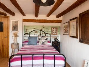 a bedroom with a bed in a room with wooden ceilings at Casa Cosialls in Benabarre +24 photos