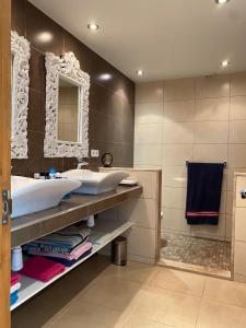 a bathroom with two sinks and a mirror at Villa Francisco in Calonge