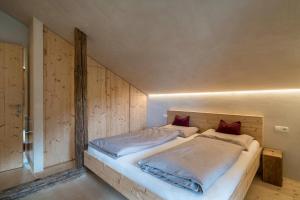 Ferienhaus im Stadl tesisinde bir odada yatak veya yataklar
