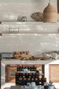a kitchen with a counter with food on it at Aliv stone suites & spa in Agios Nikolaos
