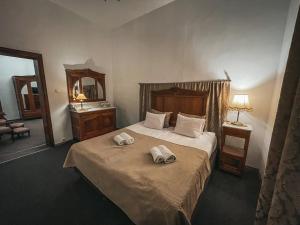 Postel nebo postele na pokoji v ubytování Zamek Rzucewo