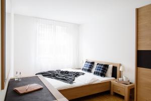 Postel nebo postele na pokoji v ubytování Nest - Voltastrasse
