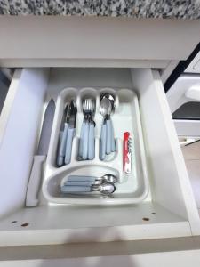 a drawer in a kitchen with utensils in it at Home Zafiro I in Santa Fe