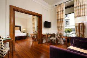 Cama ou camas em um quarto em UNA HOTELS Decò Roma