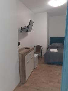 Posteľ alebo postele v izbe v ubytovaní APARTAMENTY CENTRUM PIŁSUDSKIEGO