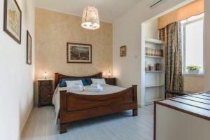 A bed or beds in a room at Alghero Roof Garden