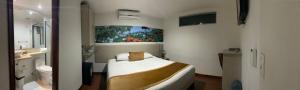 Hotel Portón Sabaneta客房内的一张或多张床位